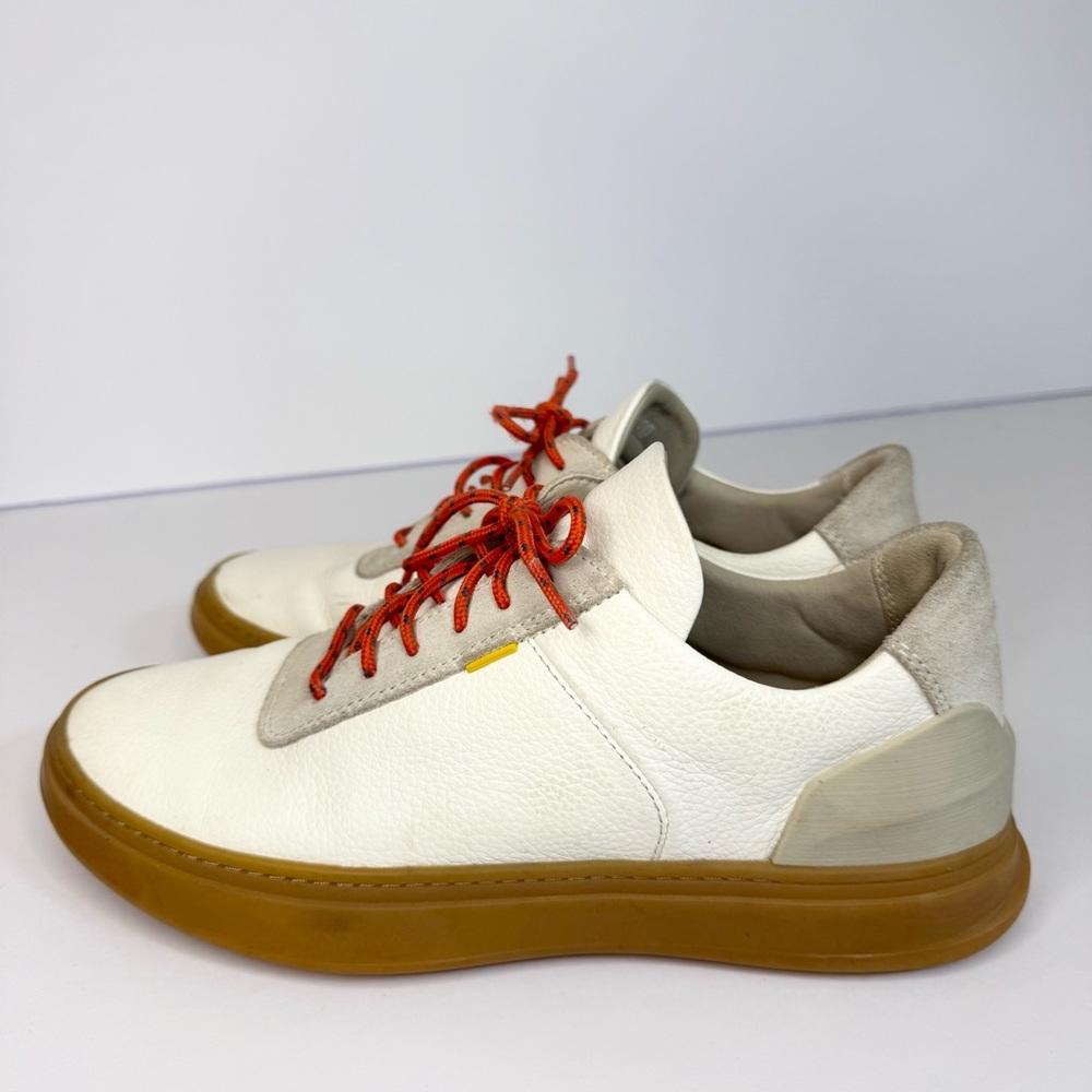 Stylish White Sneakers with Orange Accents